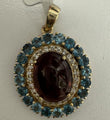14KT YELLOW GOLD TOURMALINE OVAL PENDANT WITH BLUE TOPAZ AND DIAMOND HALO